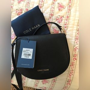 Black COLE HAAN cross body bag, adjustable.